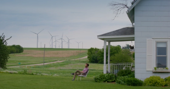 Tanner Faaborg sits in front of his home.